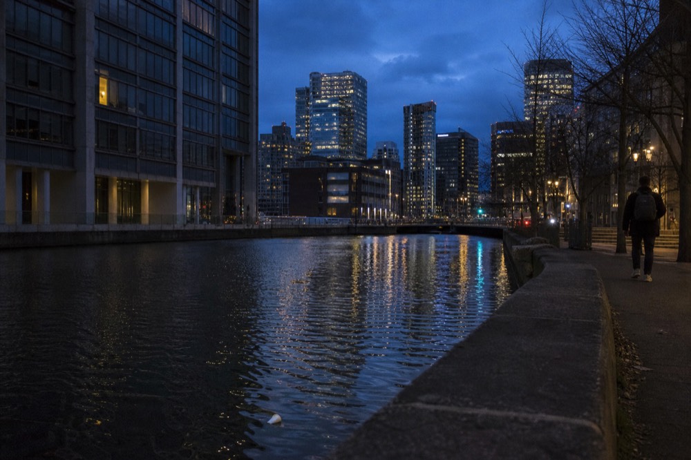 Dusk over the New River with downtown Fort Lauderdale lights reflecting on the water, no text, no logos, no people