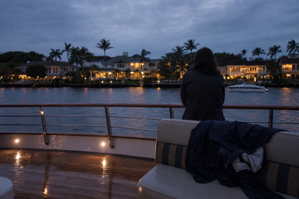 Passengers' view of waterfront mansions along the Intracoastal at dusk, no text, no logos, no people