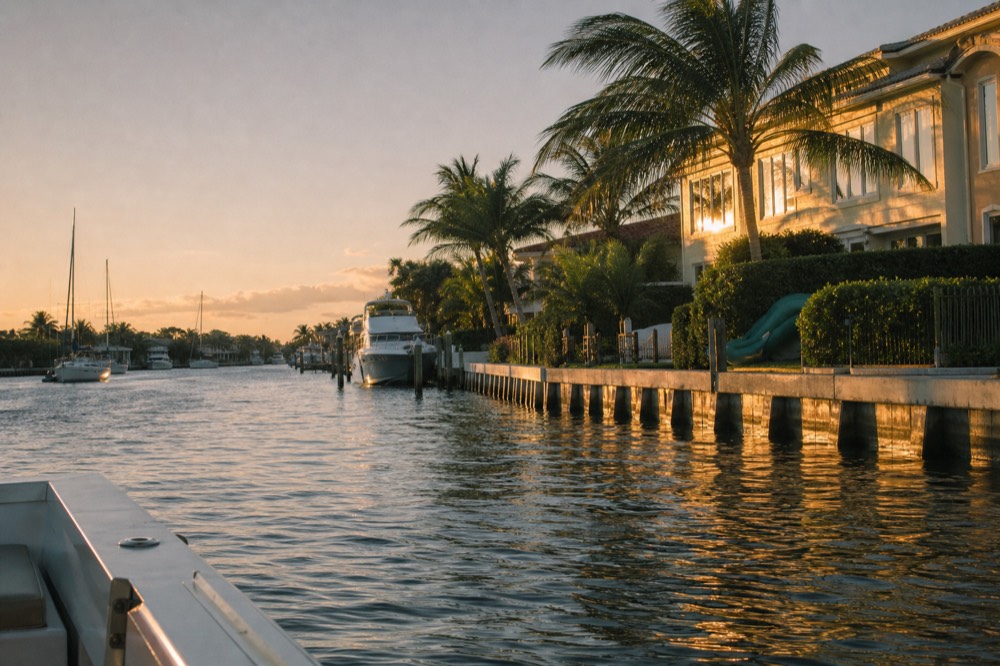 View of the Intracoastal Waterway at sunset with mansions, no text, no logos, no people