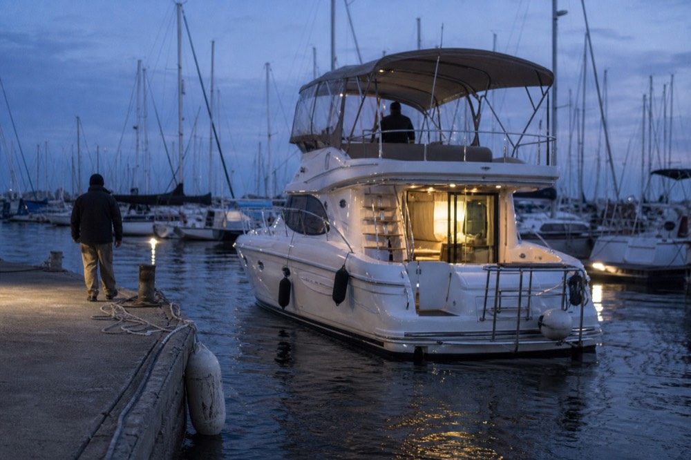 Sunset cruise boat returning to the marina, no text, no logos, no people