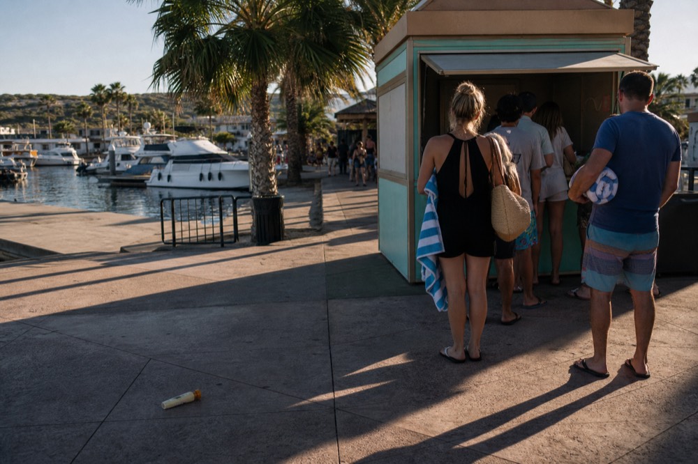 Ticket kiosk at Bahia Mar water taxi stop with route information panels, no text, no logos, no people